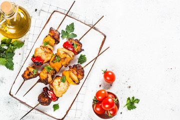 Wall Mural - Chicken kebab on skewers on white.