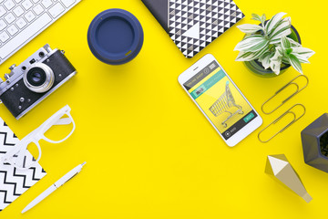 Man holds a tablet and looks at the screen. Mobile development. Innovational online businesses. Internet technologies. Trendy design. Geometry. Fashionable vibrant colors. Using a device. UX and UI.
