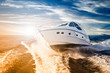 canvas print picture - Luxurious motor boat sailing the sea at dawn