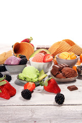 Poster - Set of ice cream scoops of different colors and flavours with berries, chocolate and fruits.