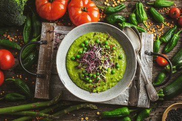 Wall Mural - Healthy green pea soup served in bowl