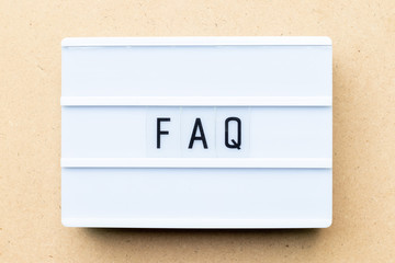 Canvas Print - White lightbox with word FAQ (Abbreviation of Frequently Asked Questions) on wood background