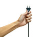 © Ton Forio - hand holding electric plug isolated from a white background. concept Save energy and reduce global warming. clipping path. illustration