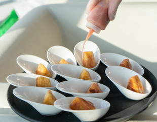 The chef covers the table with a variety of snacks.