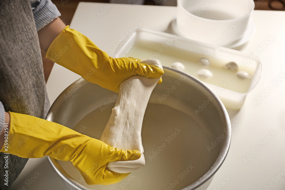 Woman preparing tasty cheese