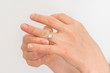 © andriano_cz - Woman cannot take off stuck wedding ring
