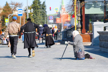 Moscow, Russia - April, 1, 2019: Beggars Begging Near The Cathedral Of Christ The Savior In Moscow, Russia