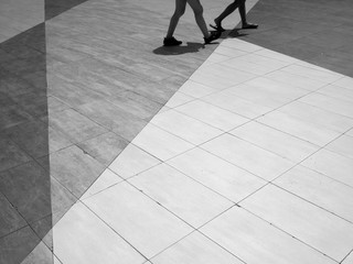 Canvas Print - black and white people walk on street floor