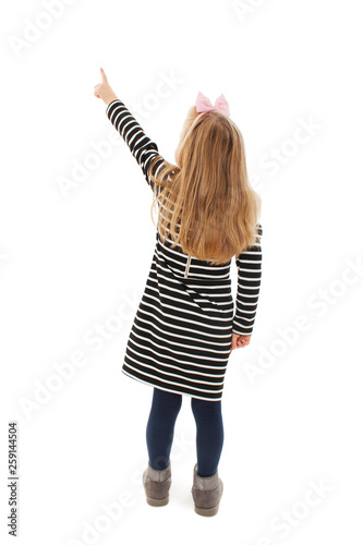 Fotomural Back view of little girl points at wall
