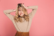 © Drobot Dean - Portrait of confused woman grabbing her head and screaming in puzzlement isolated over pink background