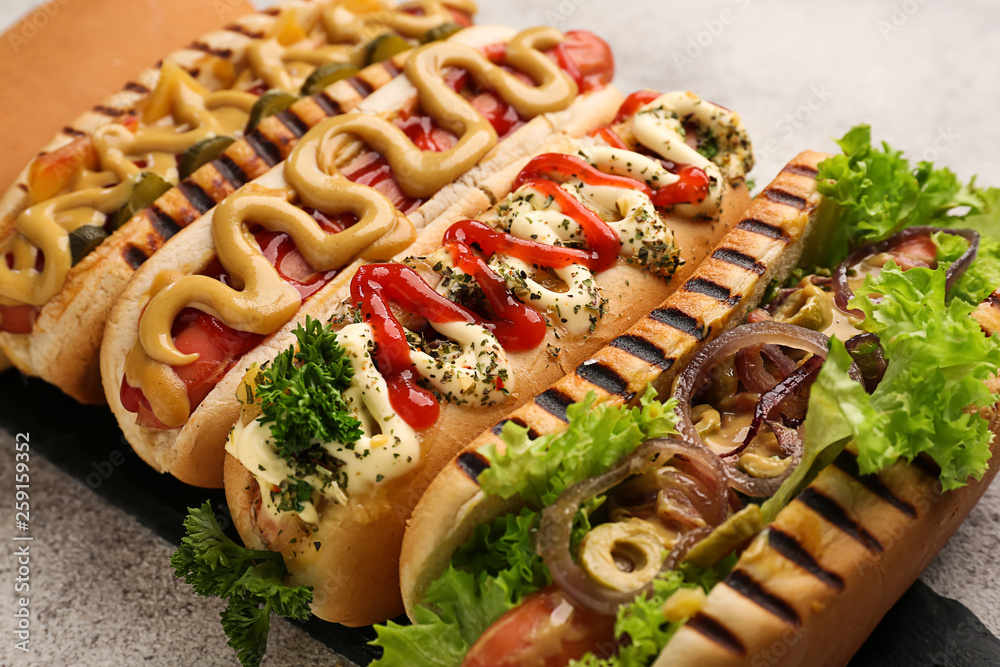 Tasty hot dogs on light table, closeup