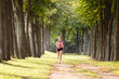 © Olga Mishyna - sport girl making exercises outdoors. Young sport woman in a park. Sport and fitness on open air. Exercise lunge leg on the grass and stretching