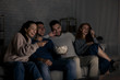 © Prostock-studio - Happy friends watching comedy film at home