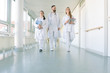 © Kzenon - Doctors, two women and a man, in hospital