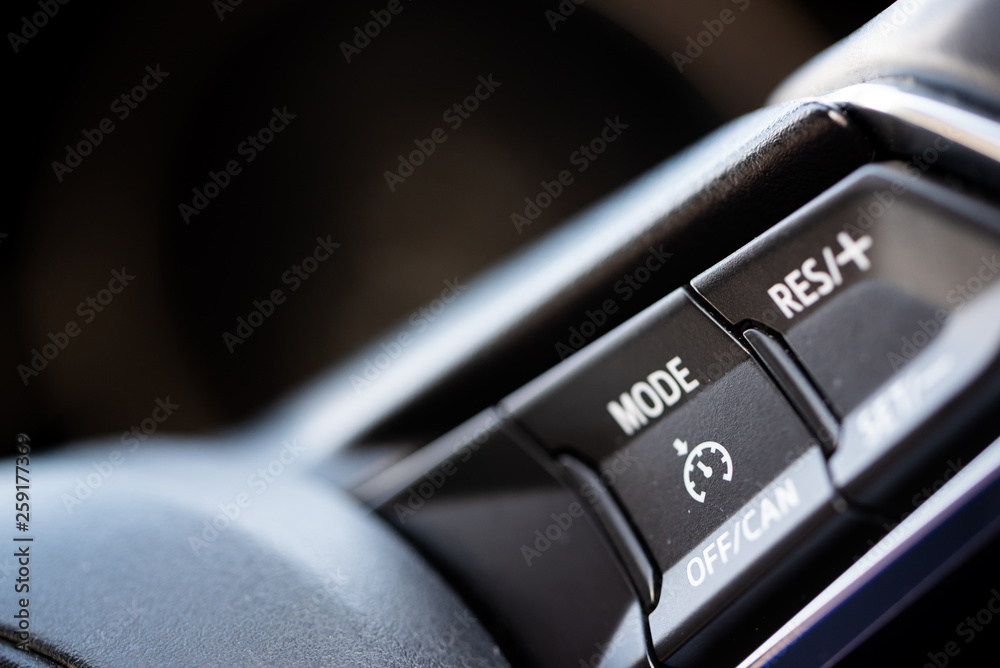 Spped Lock In Speed Limiters, close up of the buttons and dials in a car for the ...