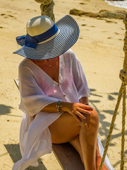 Wall Mural - Woman relaxing at the beach