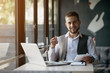 © Cressida studio - Young man drawing template for the web site associated with digital marketing, current trends and tendencies of UX / UI design. Businessman who rules his company remotely, like a freelancer