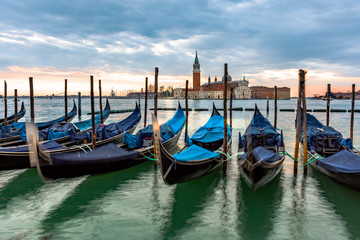  Gondolas moored in Piazza San Marco with San Giorgio Maggiore church in the background, Italy