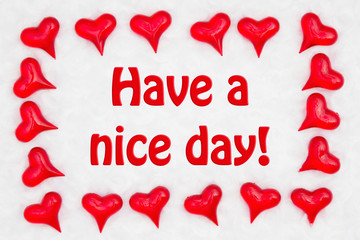 Wall Mural - Have a nice message with red hearts on white fabric