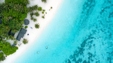 Beautiful Aerial View Of Maldives And Tropical Beach . Travel And Vacation Concept