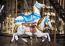 A White Wooden Horse On A Merry-go-round