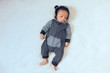 © Gerald Carter/Creative Flame - Overhead view of sleeping newborn boy in hoodie