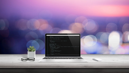 Fototapete - App development on laptop computer with code editor on display.