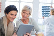 © auremar - patients using digital tablet in clinic