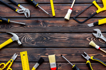 Wall Mural - constructor desk with set of building implements and brushes wooden background top view mock up