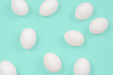 White Egg. Raw Eggs On Pastel Green Background.