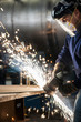 © Jetta Productions/Stocksy - Factory worker grinding on metal