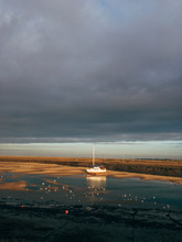 Low Tide And Boats At Sunset. Wells-next-the-sea, Norfolk, UK.