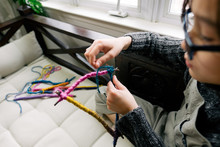 Boy Makes Mobile With Yarn And Sticks