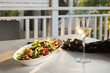 © Gillian Vann/Stocksy - thai beef salad in warm afternoon light