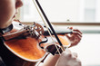 © Gabriel (Gabi) Bucataru/Stocksy - Young girl practicing violin by a window