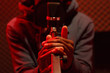 © Danil Nevsky/Stocksy - Black man recording track in sound studio on red backgraund