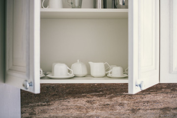 Close up of cabinet with tea set