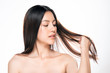 beautiful asian women are holding hair