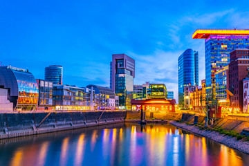 Wall Mural - sunset view of Illuminated hafen district in Dusseldorf, Germany