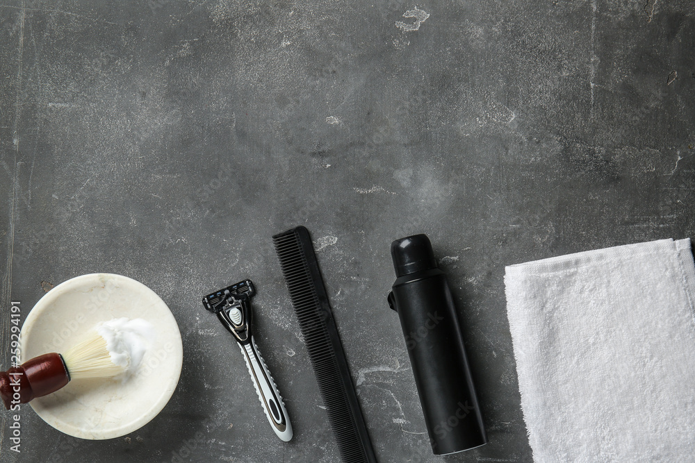 Set of male shaving accessories on grey background