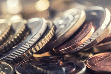 Wall Mural - A pile of euro coins freely lying on the table. Close-up european money and currency