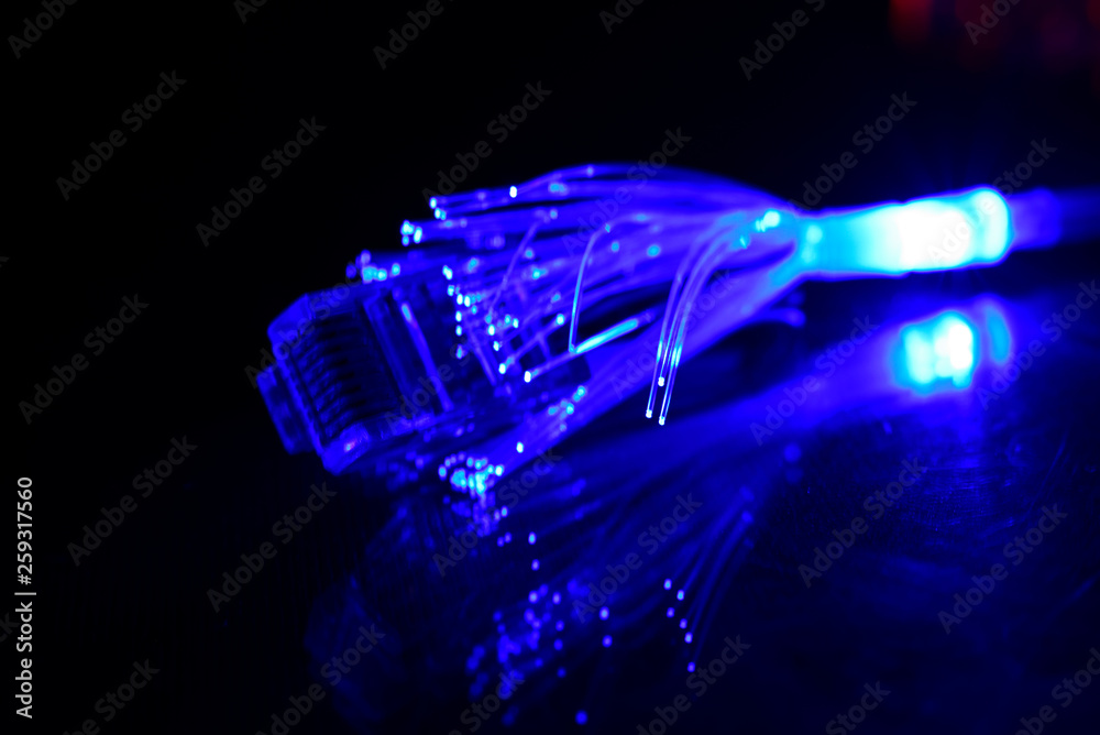 Network cable with fiber optics light on black background Stock Photo ...