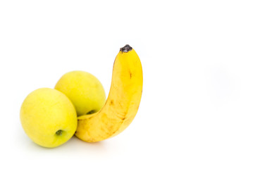 Banana and two yellow apples isolated on white background. Concept of male potency.