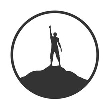 Human Silhouette With Raised Hand On The Mountain Top