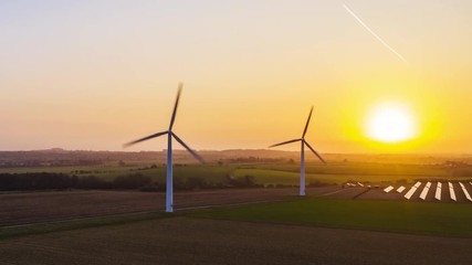 Wall Mural - Wind farm at sunrise motion time lapse