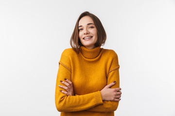 Wall Mural - Lovely young girl wearing braces standing isolated