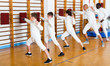 © JackF - Group practicing fencing techniques in gym