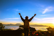 © last19 - The girl is watching the sunrise on the top of the mountain with beautiful mist.Travel relax. Natural Touch countryside. Thailand