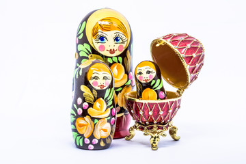 Matryoshka family. Matrioska art Russian doll and Russian souvenir, egg casket copy of Faberge on a White background