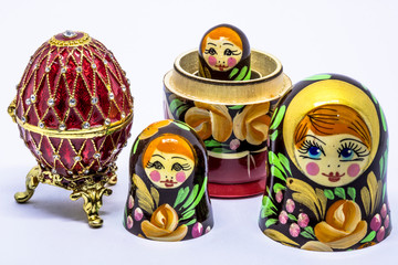 Wall Mural - Matryoshka family. Matrioska art Russian doll and Russian souvenir, egg casket copy of Faberge on a White background